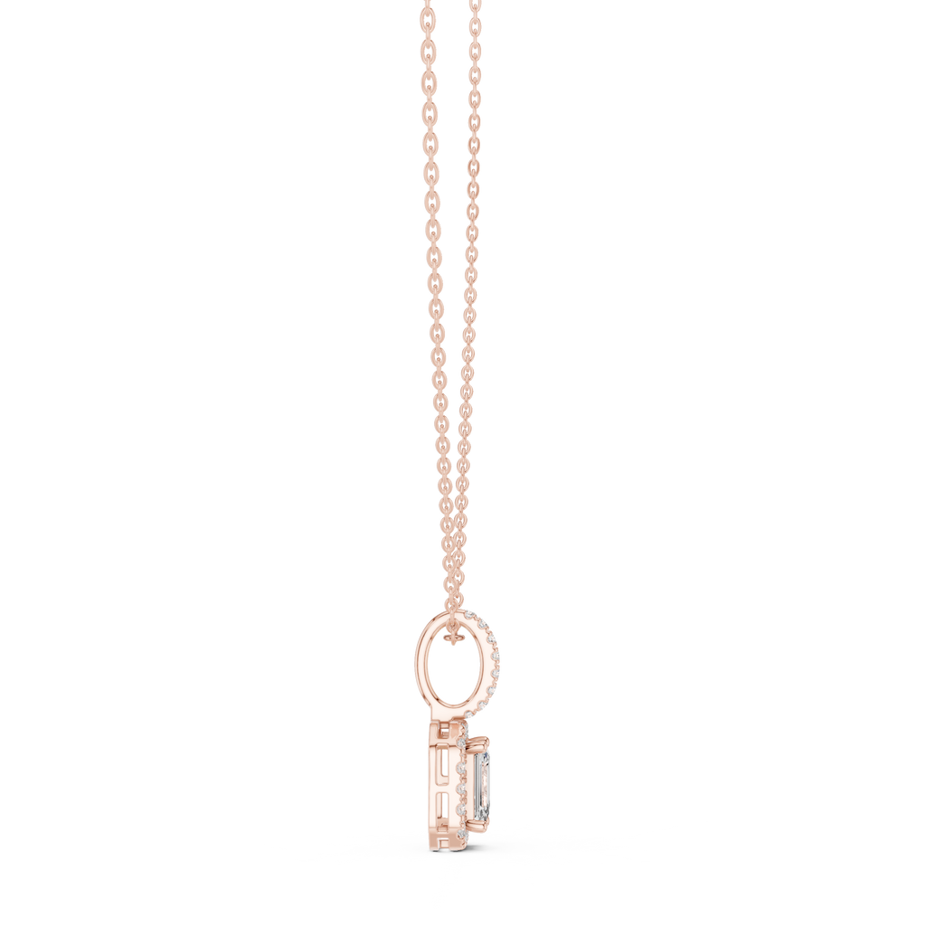 Gold emerald cut diamond pendant featuring a sparkling halo design