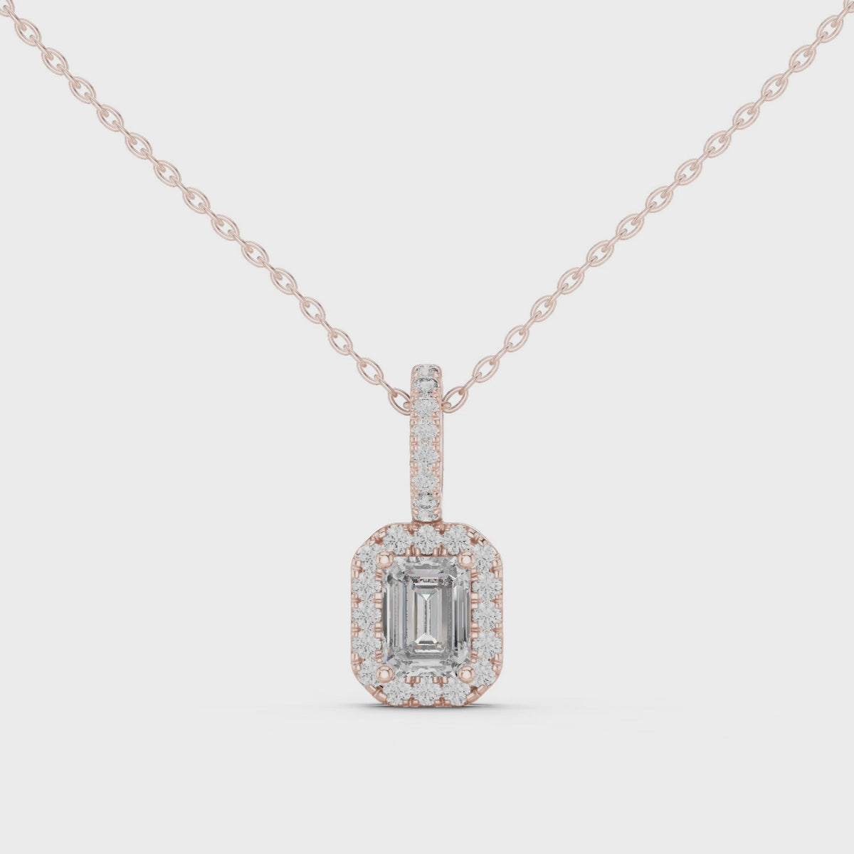 Emerald cut diamond pendant for women with sparkling diamond halo