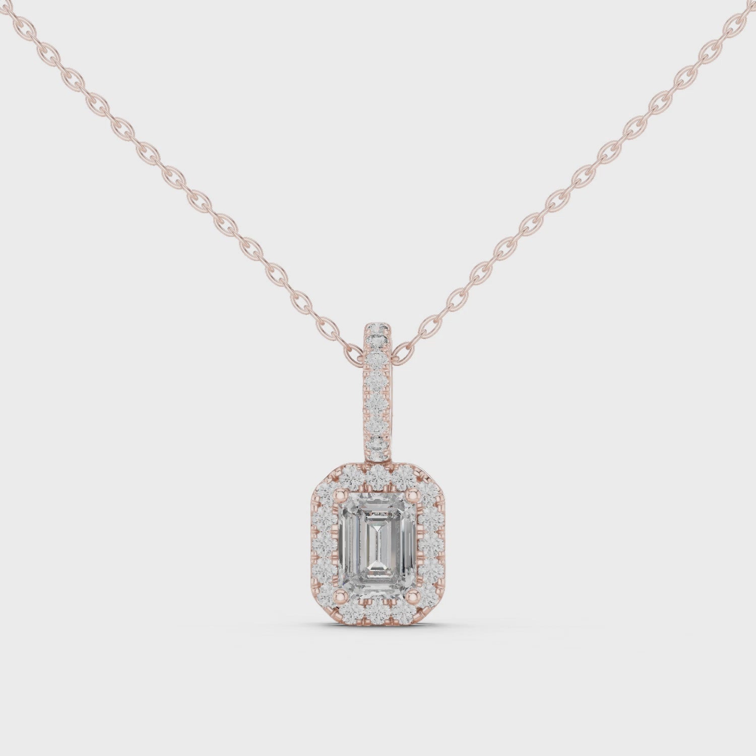 Emerald cut diamond pendant for women with sparkling diamond halo